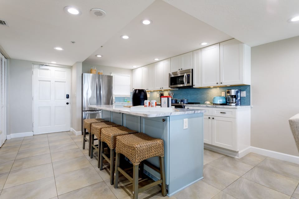 An extra spacious granite island offers four stools for extra seating.