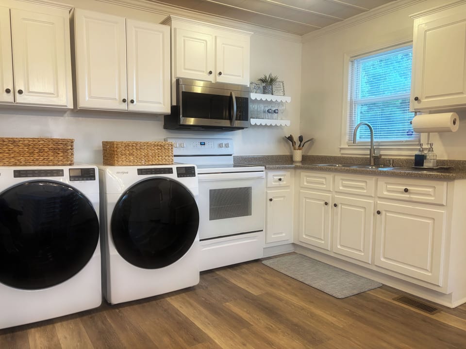 Kitchen is stocked for guest to enjoy cooking in home. 