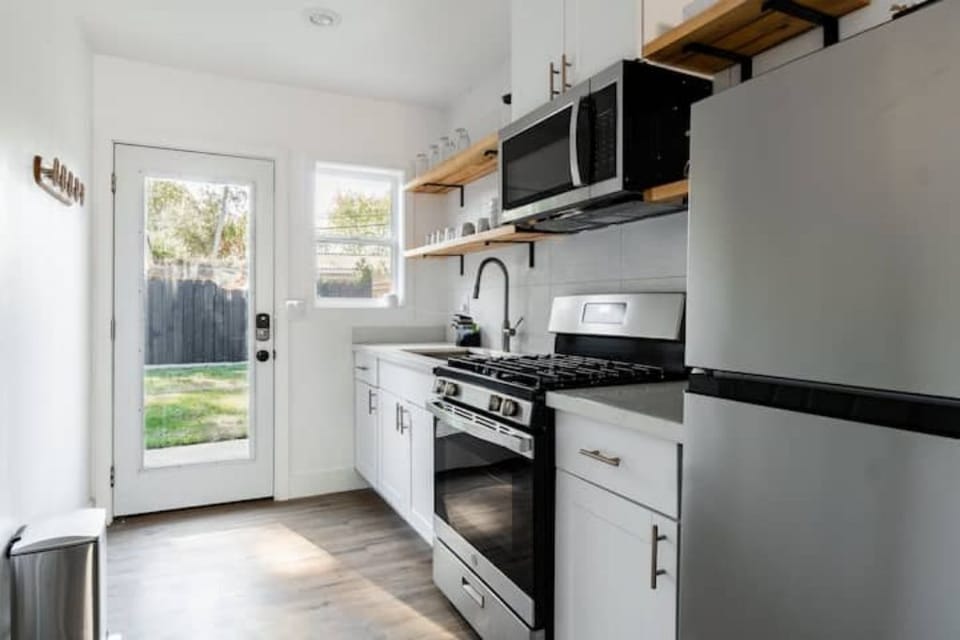 Full stock kitchen with Lawn view and back door entrance