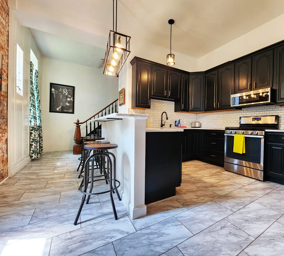 Updated and well-stocked kitchen with an oversized sink and dishwasher.