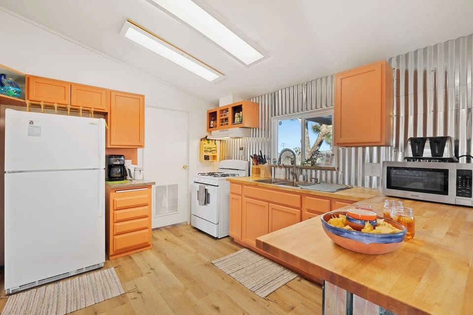 Large kitchen is fully equipped to prepare and serve a large meal for 6 people. 