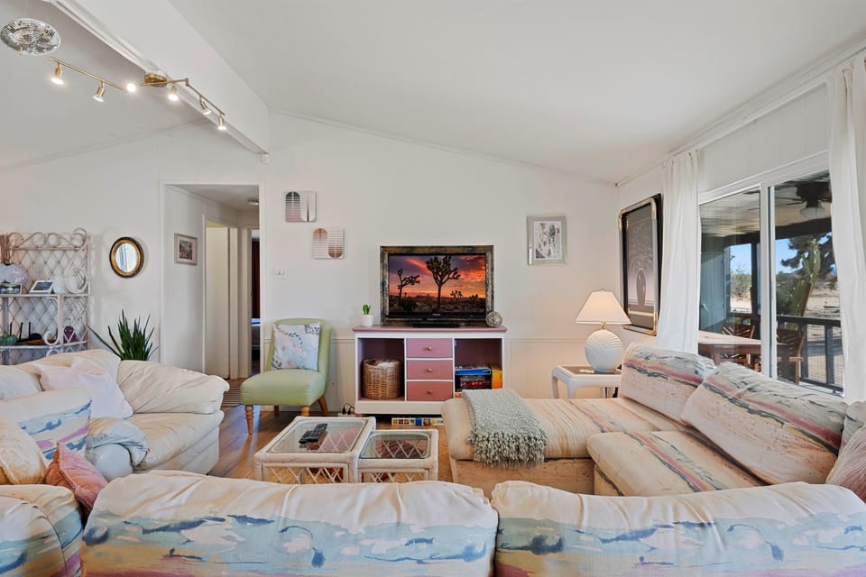 Cozy living room with plenty of space to stretch out and relax with a show or book, or just look out the window or nap