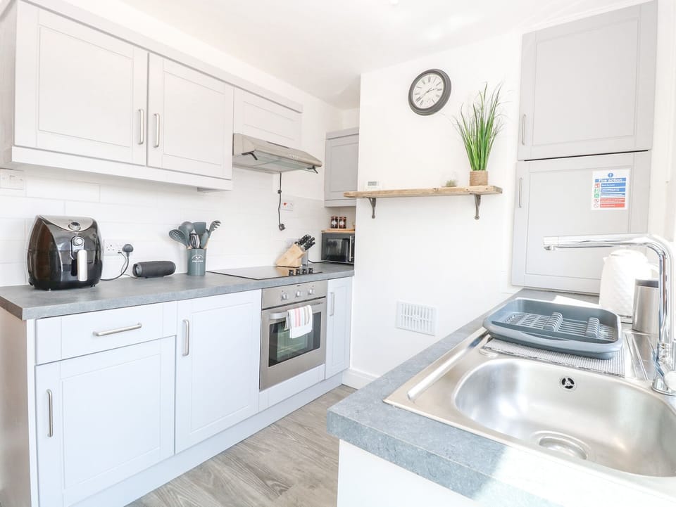 Fridge, electric kettle, toaster, cookware/dishes/utensils