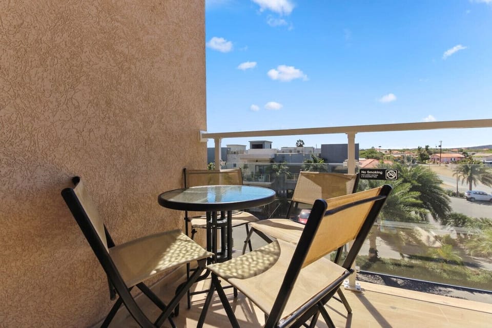 Start your day with a morning coffee on your private balcony overlooking the pool