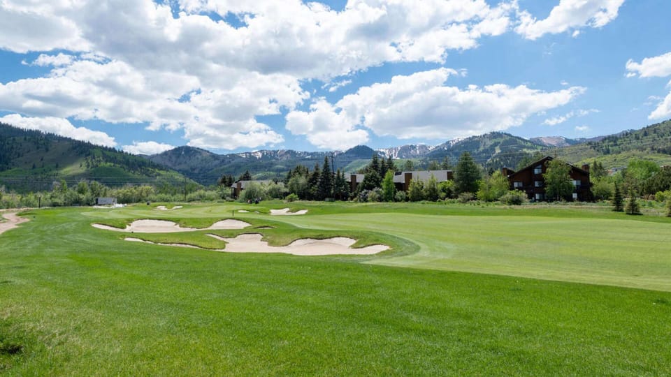 Nestled right up against a golf course.