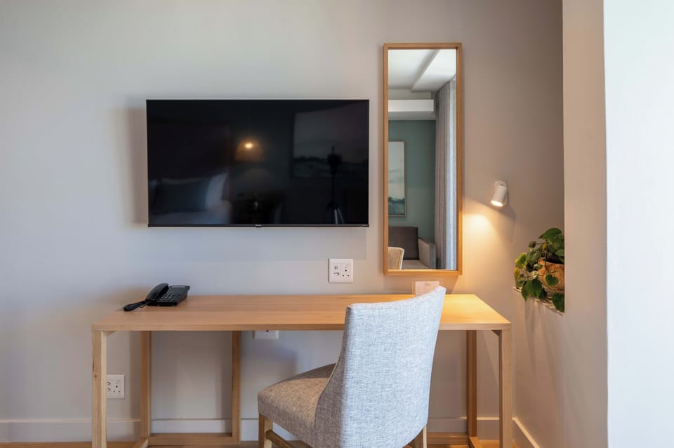 Luxury Suite, City View | Premium bedding, minibar, in-room safe, desk