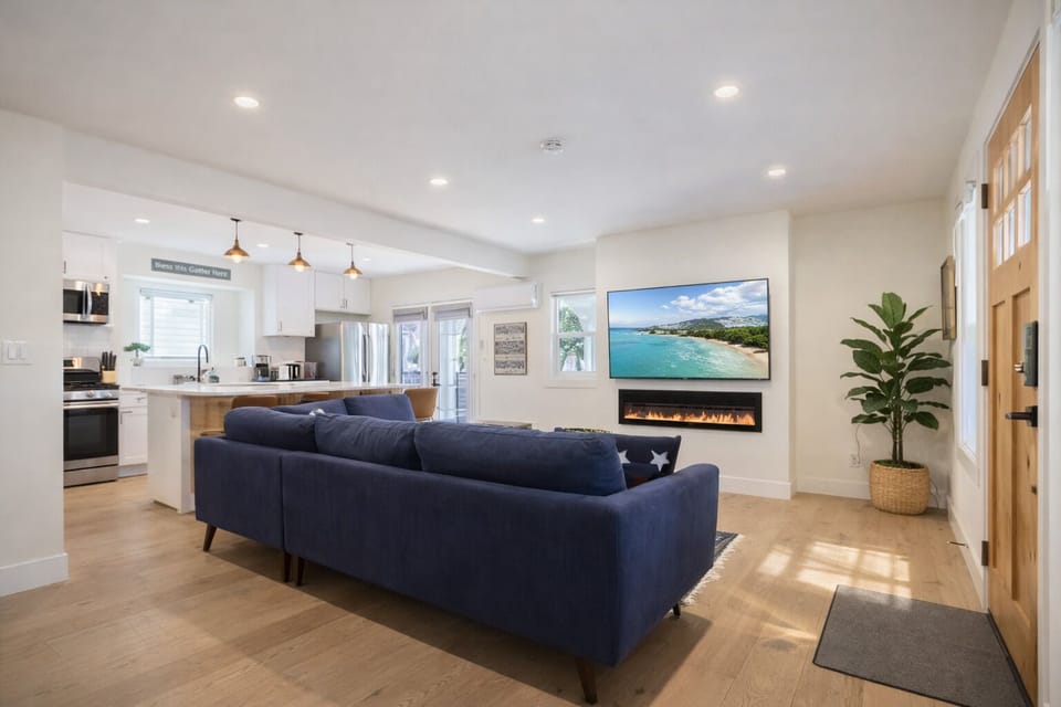 Bright open-concept living space with Smart TV near Exposition Park