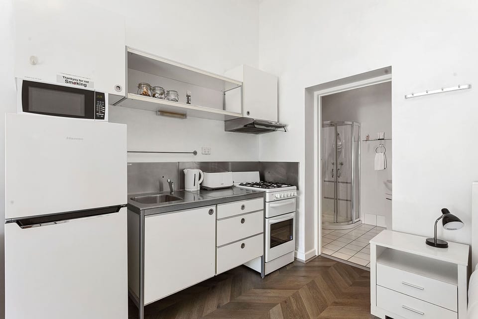 Whip up delicious meals in this well-equipped kitchen, complete with modern appliances and ample counter space.