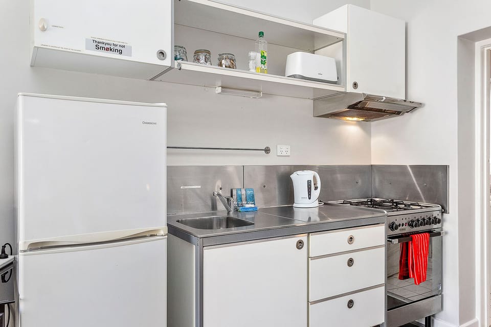 Whip up a delicious meal in this well-equipped kitchen, complete with modern appliances and ample counter space.