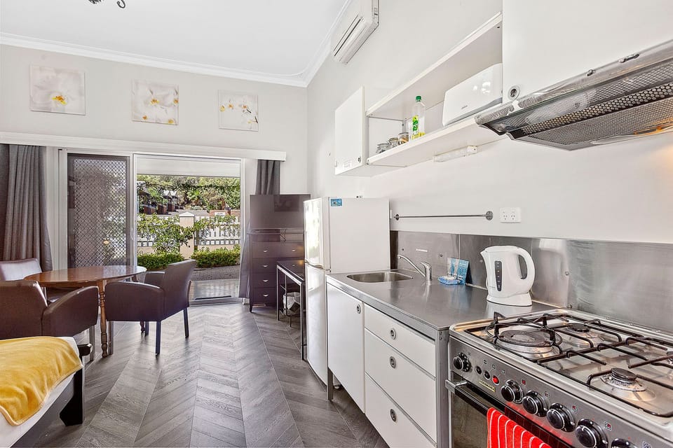 This well-equipped kitchen with a cozy living and dining area, perfect for relaxing and entertaining.