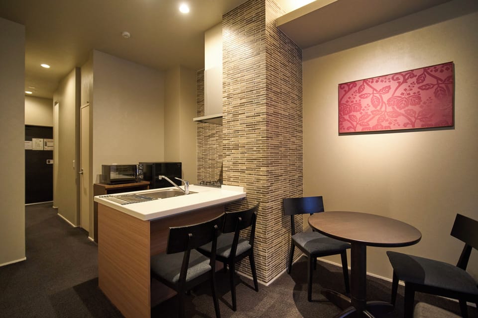 Family Twin Room with Kitchen Non-smoking | Living area | 40-inch LCD TV with digital channels