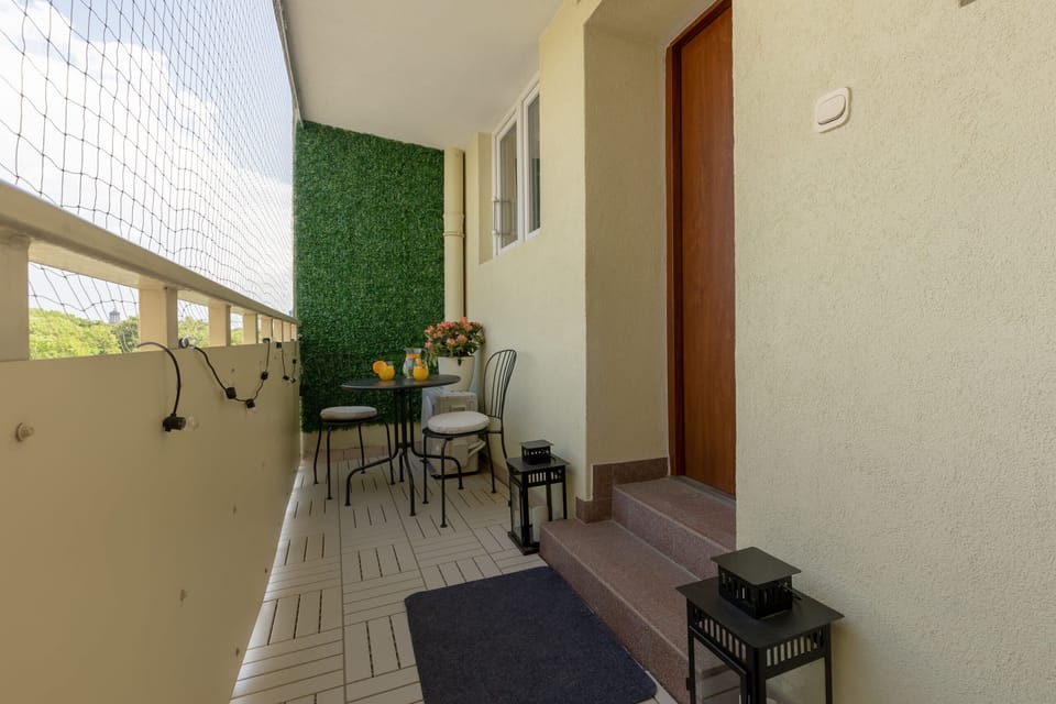 The balcony provides a perfect spot for enjoying the fresh air. 