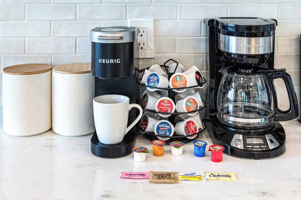 Both Keurig and drip coffee maker w/ Kcups, creamer and sweeteners provided