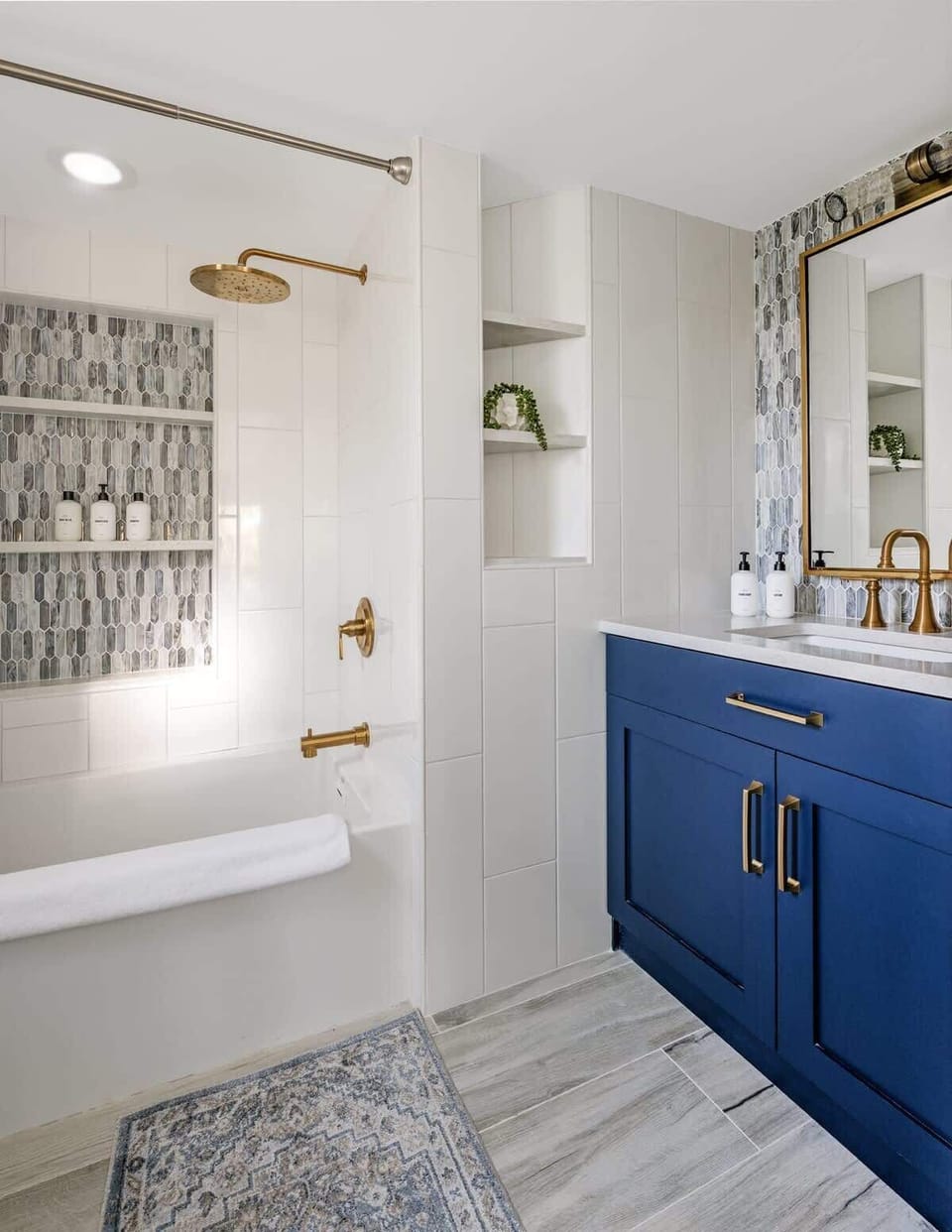 Unwind in Coastal Bliss: Step into this master en suite bathroom, where tranquility meets seaside elegance.