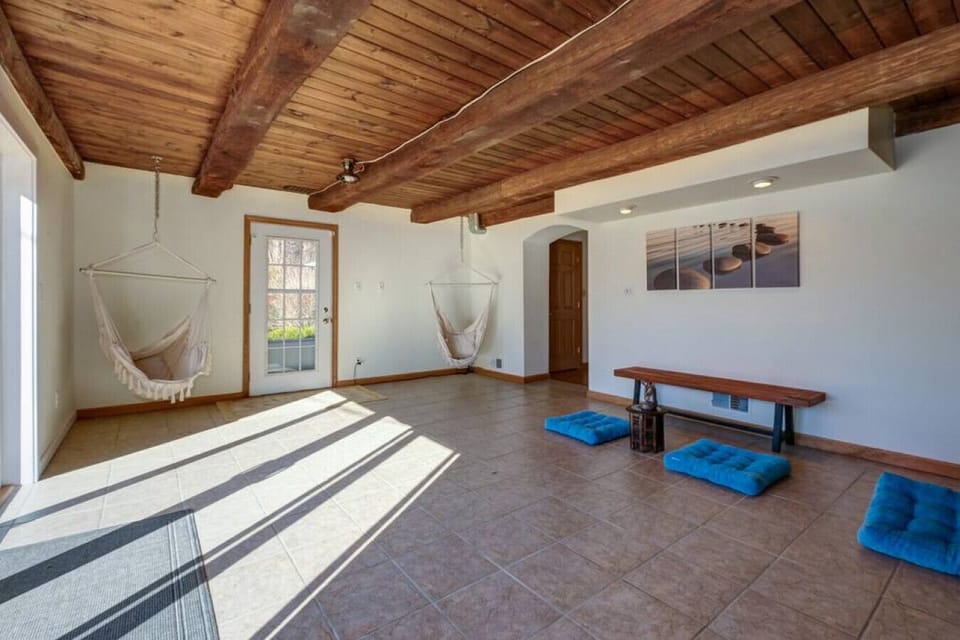 Not the workout or meditation type? Just relax in the hanging chairs and enjoy the sun streaming in through the huge patio doors!