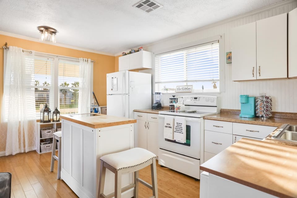 Island is movable, adjust spaces in kitchen & living rm  seats 2 or use @ dining