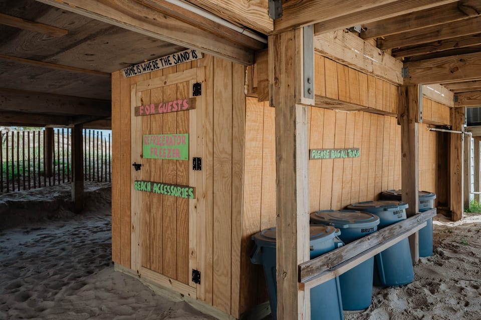 Guest storage room w/full size refrigerator/freezer, beach chairs and beach accessories. 