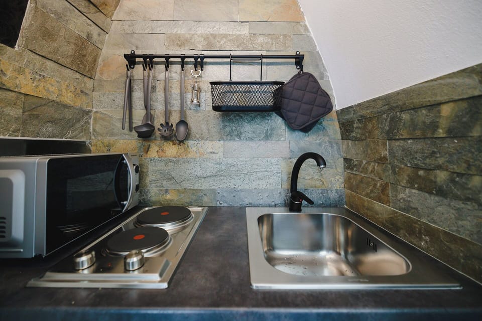 Superior Suite | Private kitchen | Espresso maker, coffee/tea maker, full-size fridge, electric kettle
