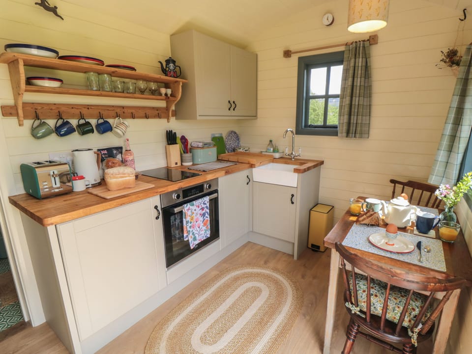 Fridge, electric kettle, toaster, cookware/dishes/utensils