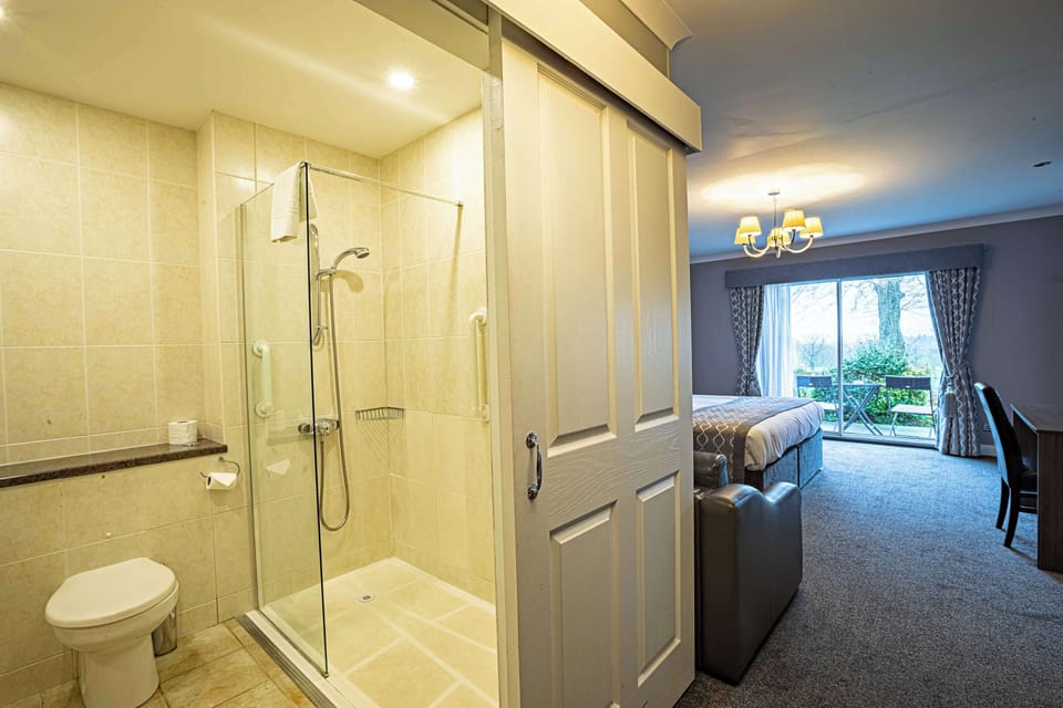 Desk, laptop workspace, blackout drapes, iron/ironing board