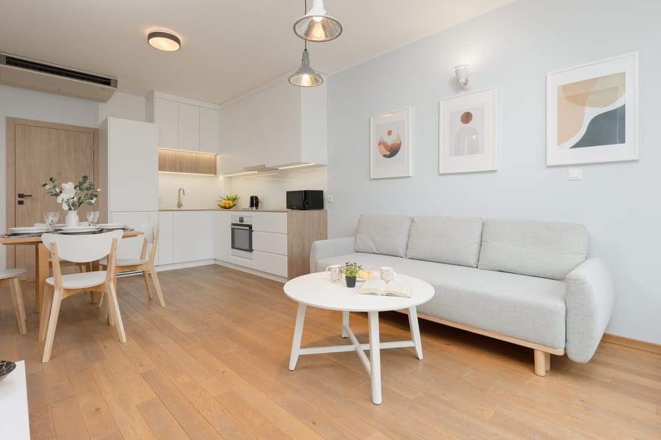 The elegant living area featuring a double sofa bed, perfect for relaxing or sleeping.