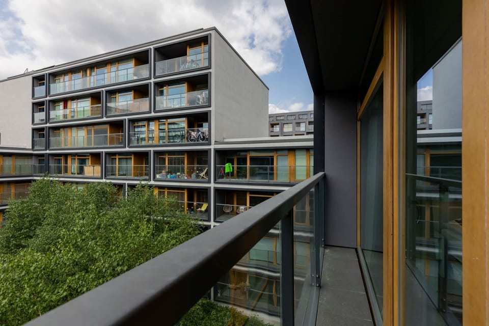 The balcony provides a perfect spot for enjoying the fresh air. 