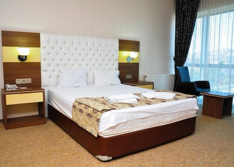 Deluxe Suite, Balcony, City View | Individually decorated, desk, laptop workspace, soundproofing