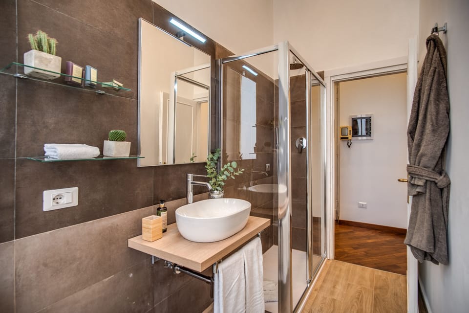 Terrace Apartment | Bathroom | Shower, rainfall showerhead, free toiletries, hair dryer