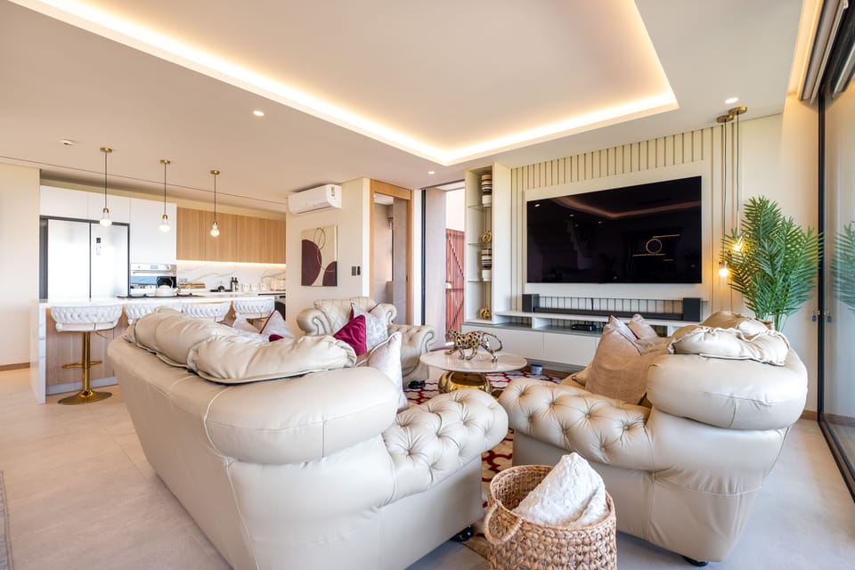 Exclusive Villa | Living area | 80-inch flat-screen TV with cable channels, TV, Netflix