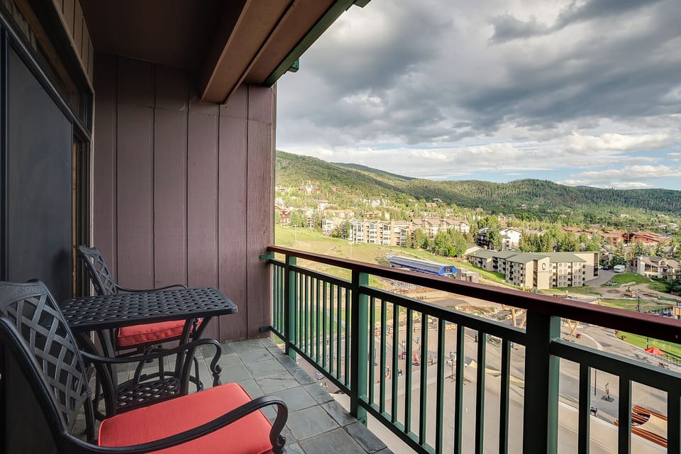 Unwind on your private balcony with mountain views and comfortable seating for peaceful moments above the valley.