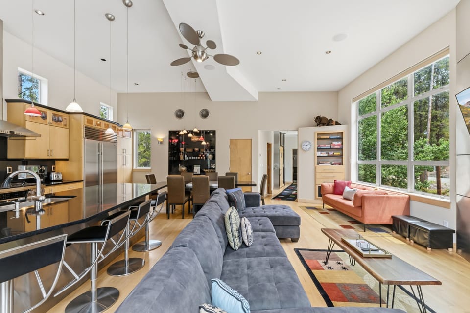 Your spacious open-plan living area invites relaxation with vaulted ceilings, abundant natural light, and thoughtful design connecting the kitchen, dining, and lounge spaces seamlessly.