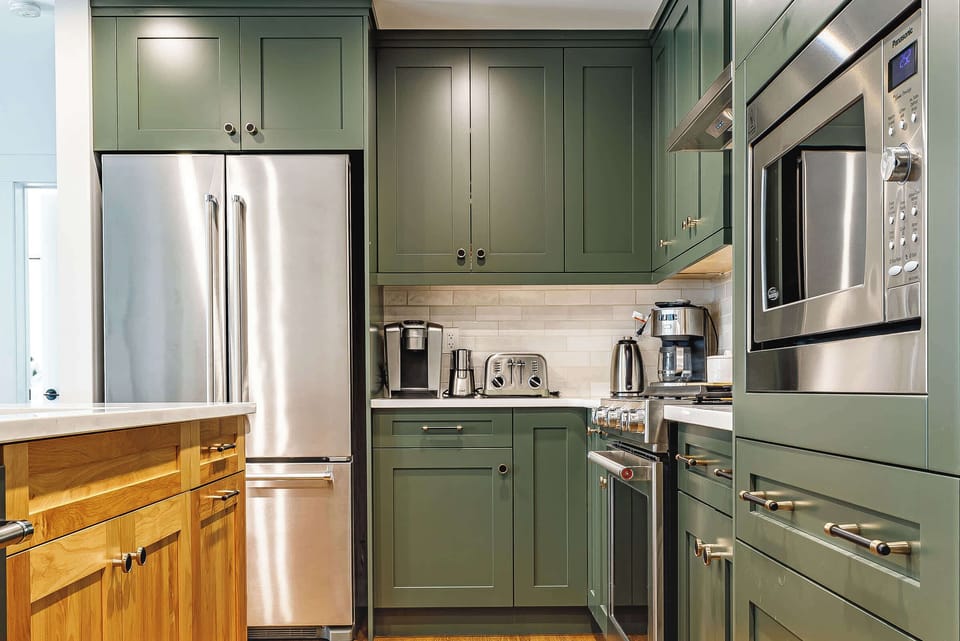 Beautifully appointed kitchen with luxury appliances and luscious stone countertops