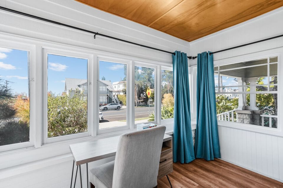 Work remotely with tons of natural light and a great view of the neighborhood