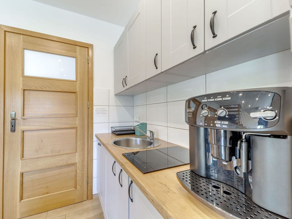 Cabinetry, Countertop, Furniture, Kitchen Appliance, Kitchen, Kitchen Stove, Home Appliance, Wood, Kitchen Sink, Building