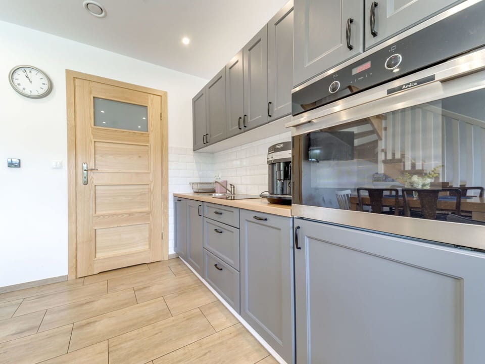 Cabinetry, Countertop, Property, Building, Kitchen Appliance, Kitchen, Wood, Lighting, Interior Design