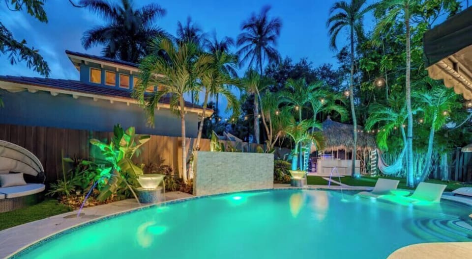 Heated Pool & Lush fenced private back yard with water features, artificial turf, hammock, swings and Talum feel. 