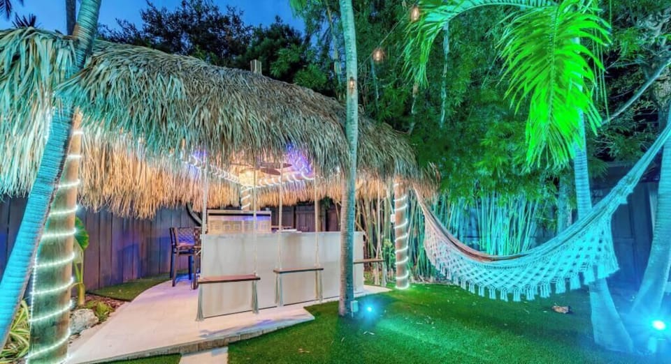 Outdoor Oasis with Heated Pool, Lighting, Magic Bowls, Waterfall, Tiki Hut, Hammock, Swings, BBQ, Outdoor Table, Sound system & More!!