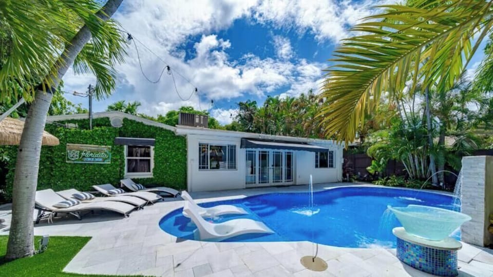 Heated Pool & Lush fenced private back yard with water features, artificial turf, hammock, swings and Talum feel. 