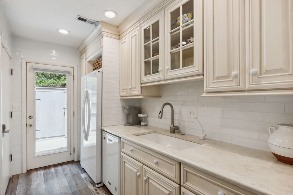 Sunny Galley Kitchen with Quartz Countertops