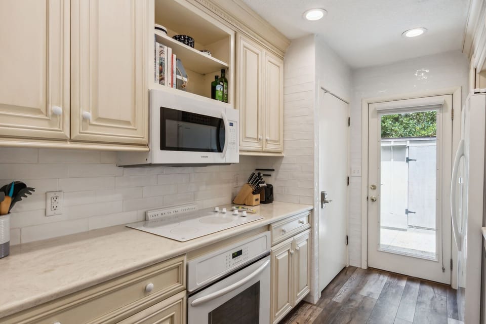 Sunny Galley Kitchen with Quartz Countertops