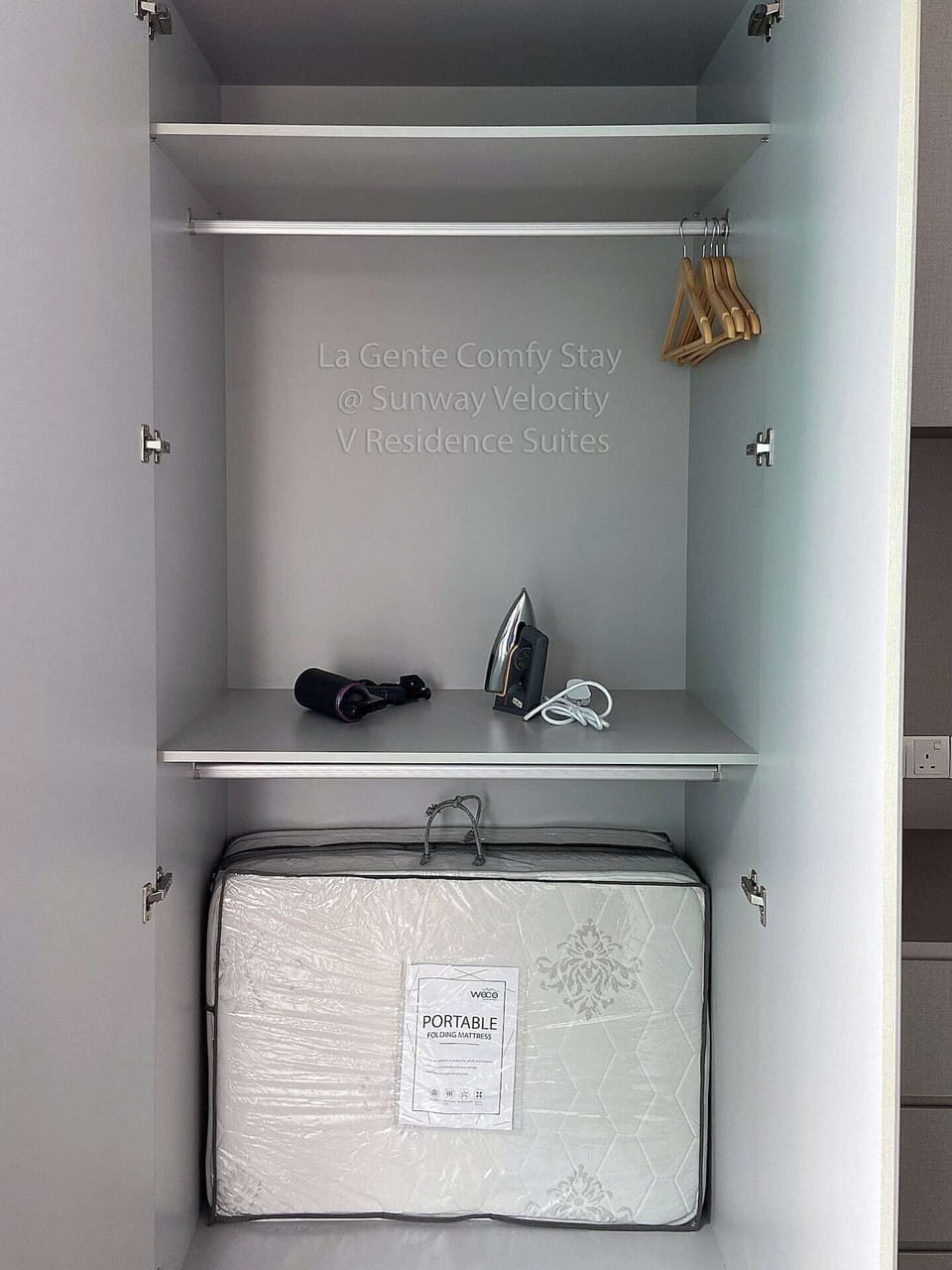 Clothes hangers, hair dryer, iron and iron board (not in the picture) provided for our guests home experience.

Extra foldable mattress for extra guest to rest in the living room