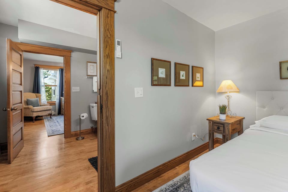 Suite 2 includes 2 separate bedrooms both featuring a queen bed with shared bathroom in the middle featuring a tub/shower combination