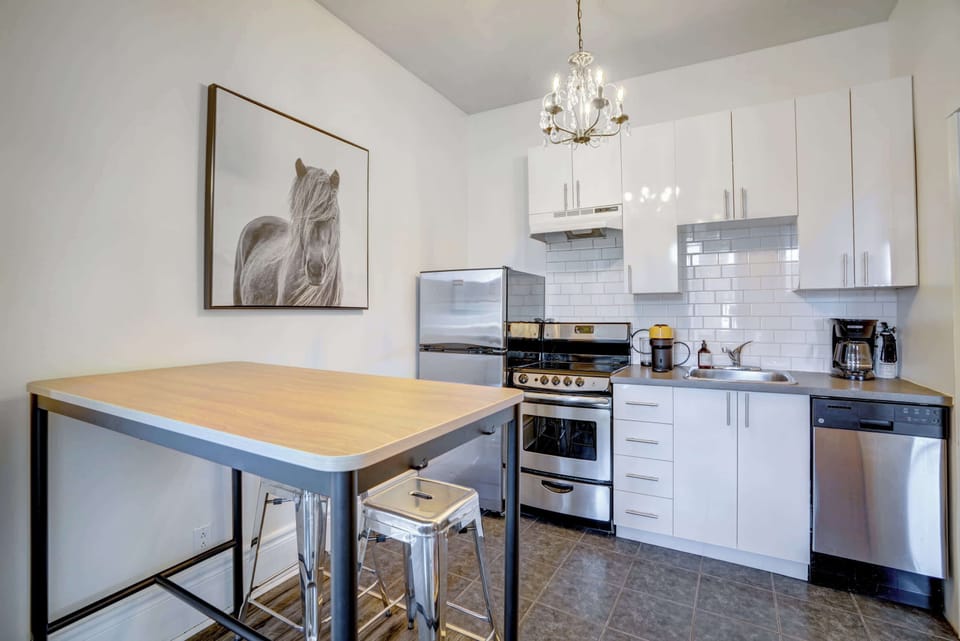 Bright and fully-equipped kitchen with a Nespresso machine.