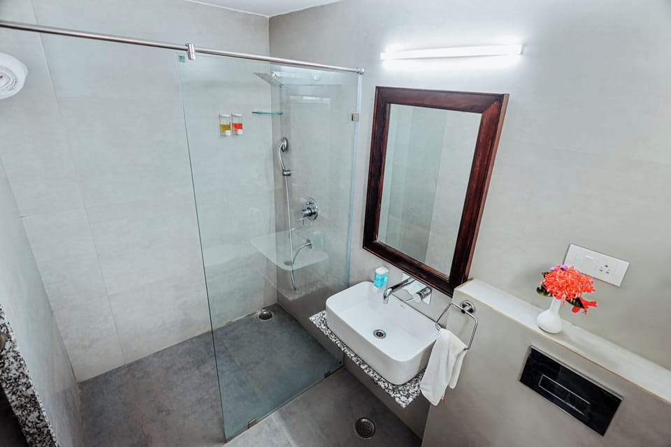 Shower, rainfall showerhead, designer toiletries, slippers