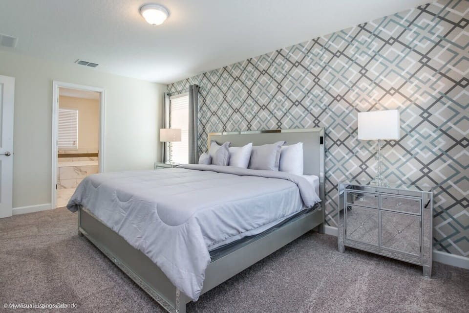 Recharge in comfort in this inviting king bedroom, complete with a plush king bed, flat-screen TV, high-speed Wi-Fi, and a relaxing atmosphere perfect for unwinding after a fun-filled day.