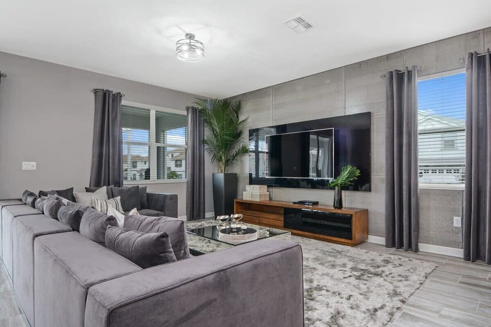 Unwind in the beautifully furnished great room, where upgraded décor, comfortable seating, a large flat-screen TV, and high-speed Wi-Fi create the perfect setting for family time and relaxation.