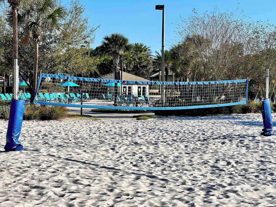 Challenge friends to a game on the resort's sand volleyball court, a great way to stay active while enjoying the beautiful resort surroundings.