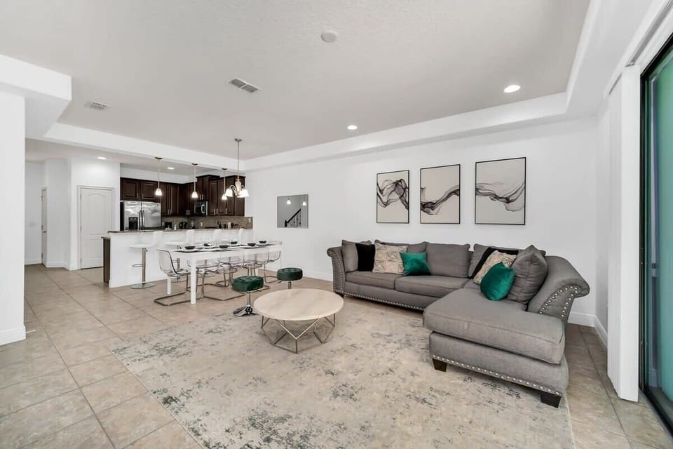 Relax in the comfortable living area featuring plush seating, a large flat-screen TV, and high-speed Wi-Fi—perfect for movie nights, streaming, or unwinding after a day of adventure.