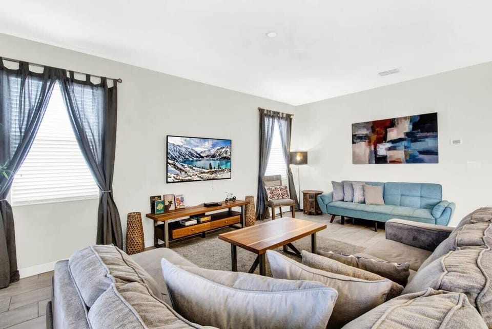 Recharge in comfort in this inviting queen bedroom, complete with a plush queen bed, flat-screen TV, high-speed Wi-Fi, and a peaceful atmosphere perfect for unwinding after a fun-filled day.