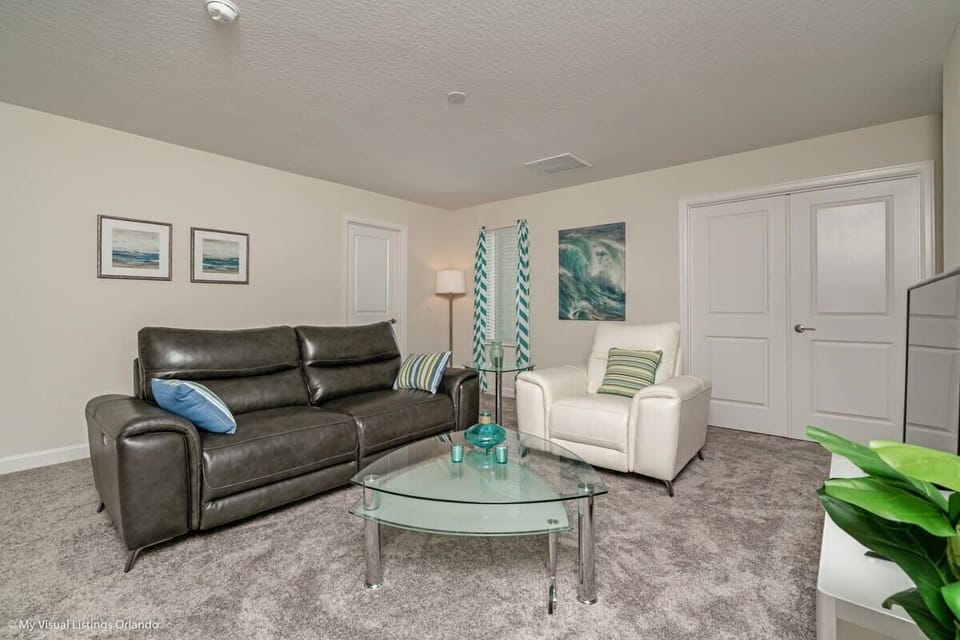 Relax in the comfortable living area featuring plush seating, a large flat-screen TV, and high-speed Wi-Fi—perfect for movie nights, streaming, or unwinding after a day of adventure.